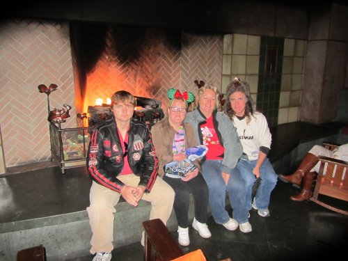 Family by fireplace at Grand Californian