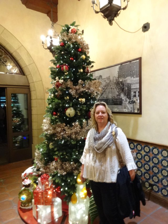 Lori in front of tree
