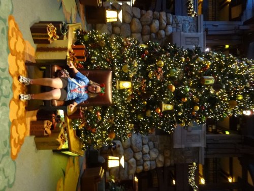 Melissa by tree in lobby of Grand Californian