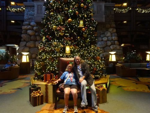 Melissa and dad by tree in lobby of Grand Californian