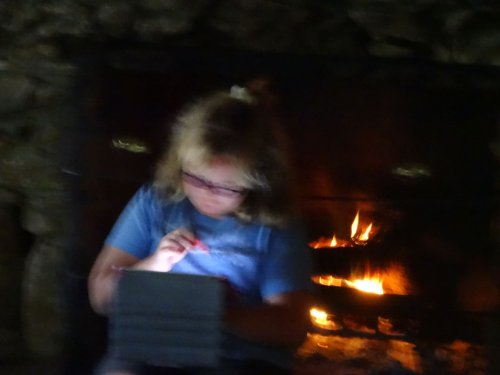 Missy sitting by the fire
