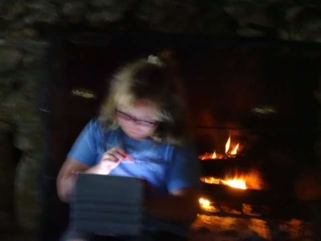 Missy sitting by the fire