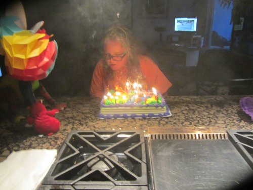 Missy blowing out candles