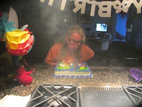 Missy blowing out candles