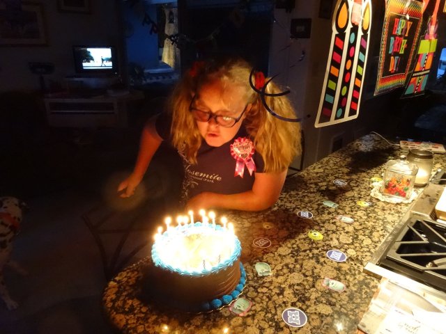 Missy blowing out candles