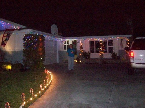 Lori in front of our house 