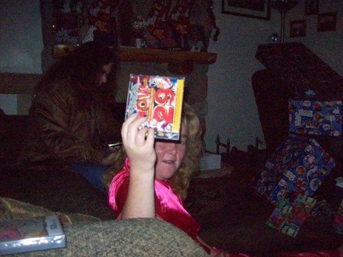 Melissa showing off new music CD 
