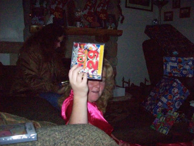 Melissa showing off new music CD 