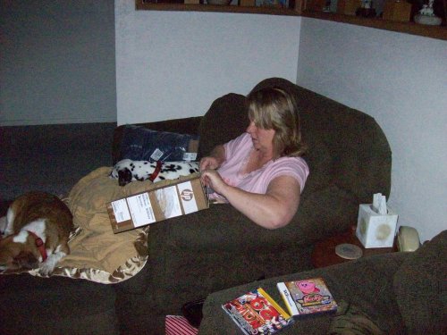 Lori unwrapping her new computer 