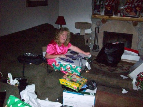 Missy vigorously unwrapping gifts 