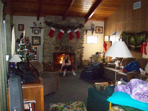 Melissa sitting in front of the fire 