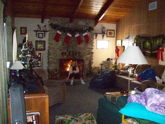 Melissa sitting in front of the fire 