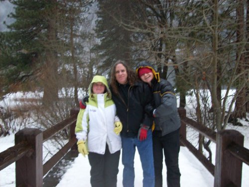 Family on bridge during rain 