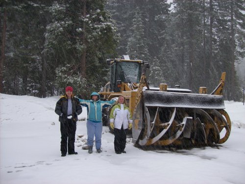 Family by big snowblower 