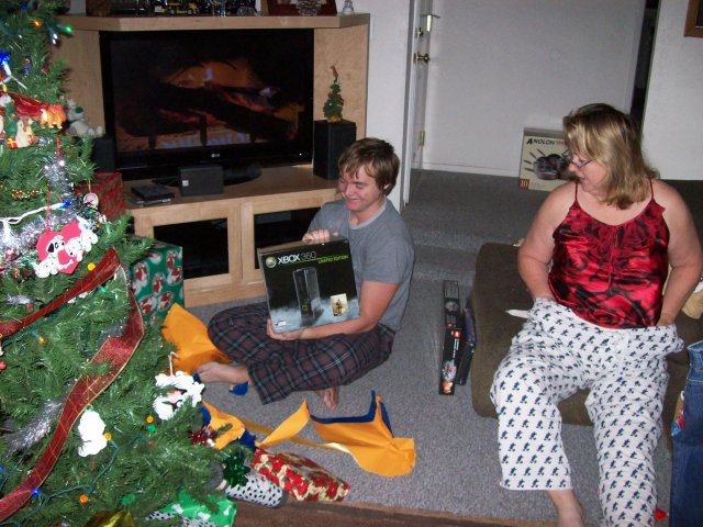 Jonny unwrapping his new X-Box 