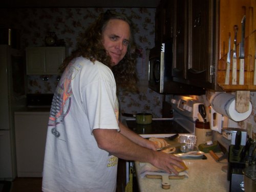 Dad carving the bread 