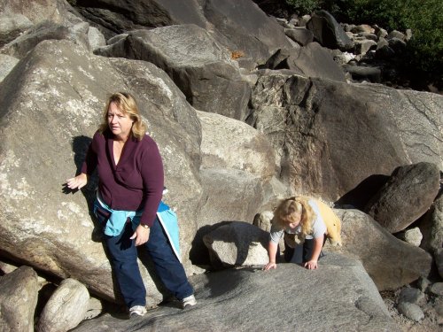 Mom and Melissa scrambling up rocks to base of Yosemite falls 