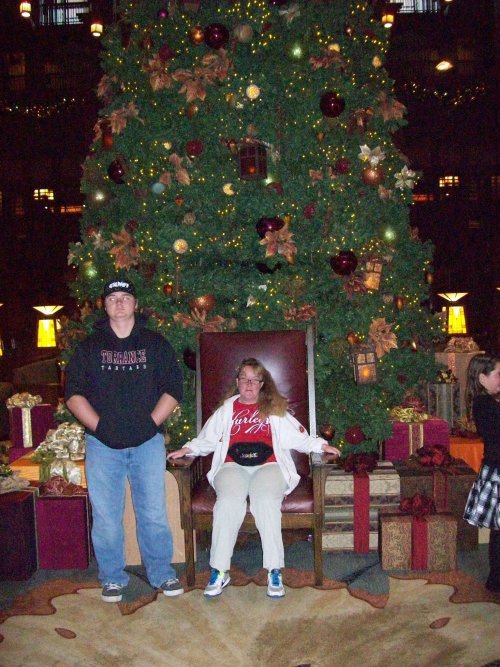Jonny and Melissa by Christmas tree in Grand Californian 
