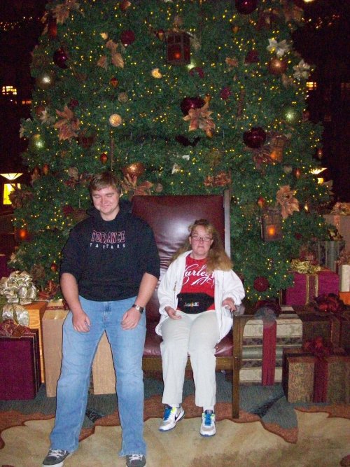 Jonny and Melissa by Christmas tree in Grand Californian 