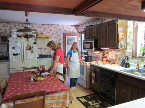 Melissa and mom preparing Thanksgiving dinner 