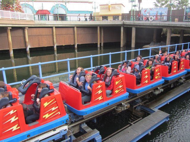 Dad and kids on roller coaster