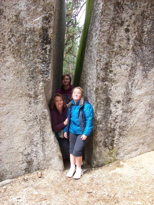 Family in split boulder 