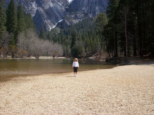 Melissa throwing rocks in the river 