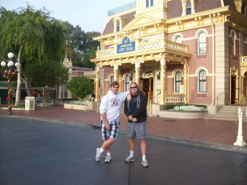 Jonny and dad by the city hall in Disneyland 