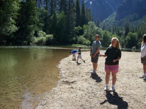 Kids throwing rocks at Cathedral Beach 