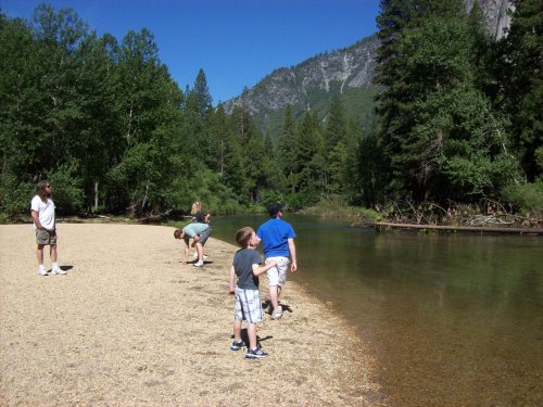 Kids skipping rocks 