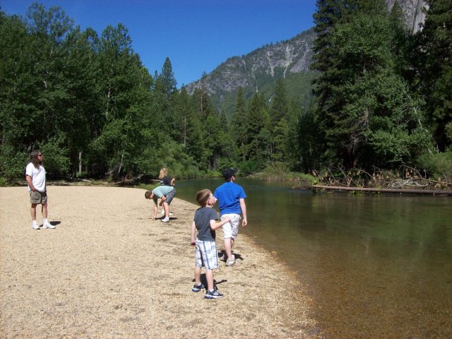 Kids skipping rocks 