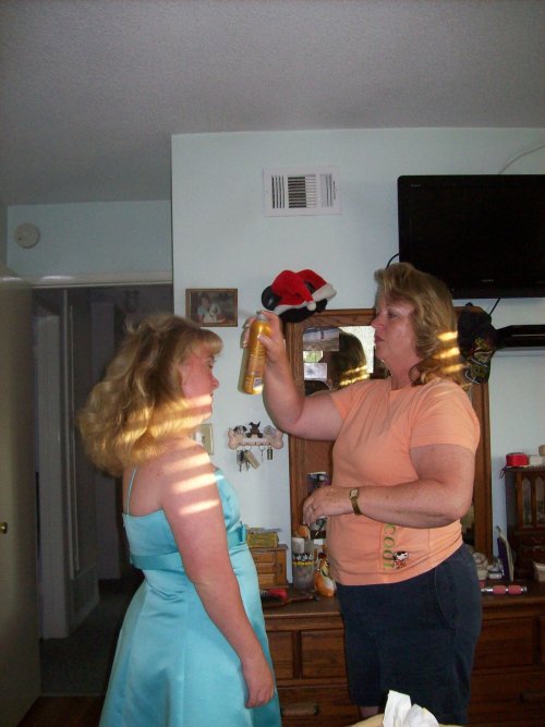 Mom helping Melissa get ready for the prom 