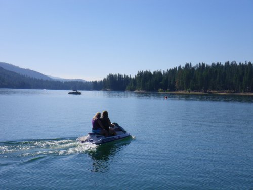 Mom and daughter heading out on the nice quiet lake 