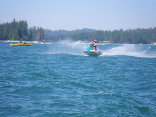 Mom and Missy skipping over the waves 