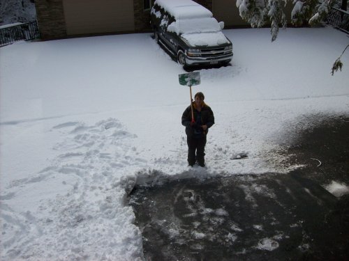 Lori shoveling snow 