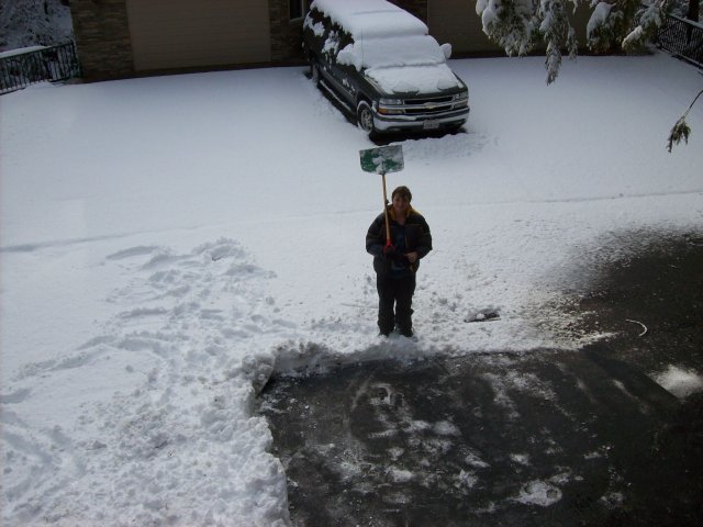 Lori shoveling snow 