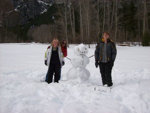 Family and snowman in Yosemite 