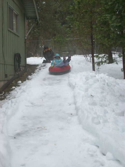 Lori sliding in the backyard 