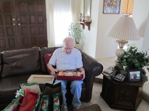 Grandpa opening Christmas presents 