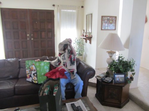 Grandpa opening Christmas presents 