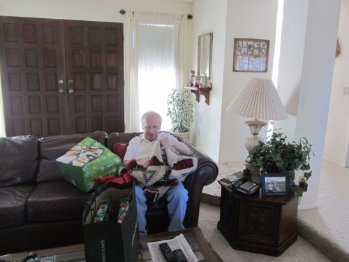Grandpa opening Christmas presents 
