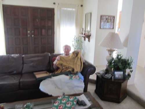 Grandpa opening Christmas presents 