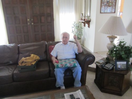 Grandpa opening Christmas presents 