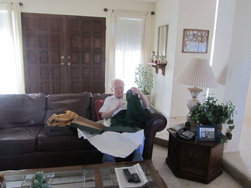Grandpa opening Christmas presents 