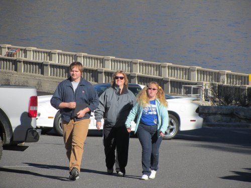 Mom and kids hiking back from dam 