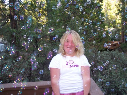 Melissa surrounded by bubbles 