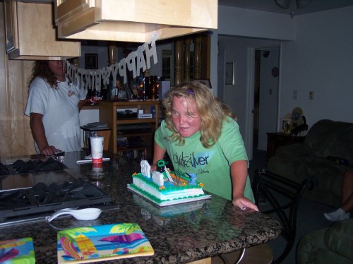 Melissa blowing out candles 